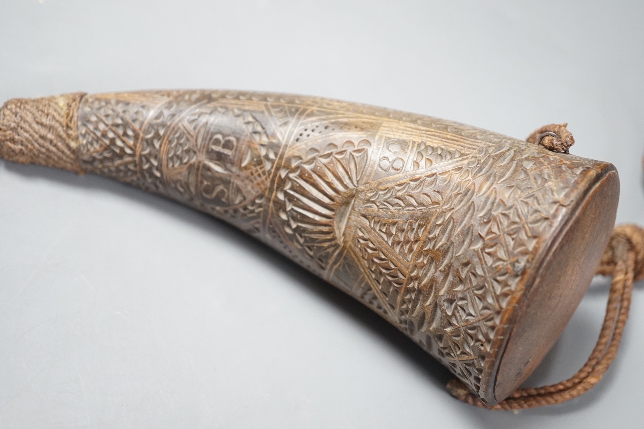 A 19th century horn flask carved with Masonic emblem, the name ‘James William Finn’ and the initials S.B. 20cm